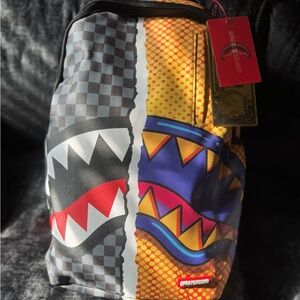 Sprayground Vibrant Shark Backpack with Red and Yellow Accents